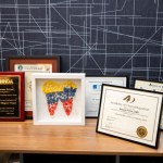 desk with framed awards from Dr. Porras